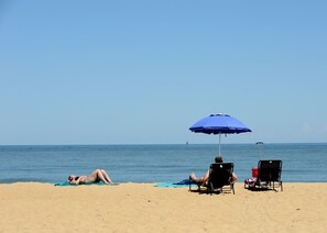 On the beach, sun-loungers, beach towels