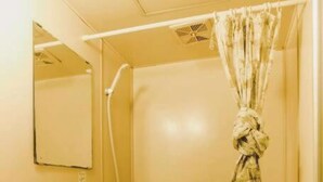 A small, compact bathroom with a toilet, sink, and shower. - Home WIFI & Compact & Tranquil Apt with LOFT! (杉並区)