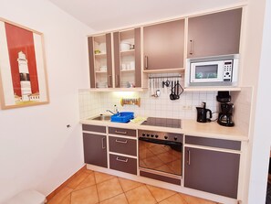 Fridge, microwave, oven, high chair