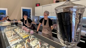 A dessert counter with multiple ice cream options, a large glass container, and a clock on the wall. - Seafront historical villa with fabulous garden and private pool (Marina Serra)