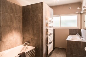 Combined shower/tub, hair dryer, towels, toilet paper