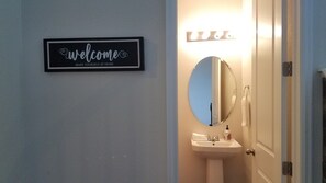 Combined shower/tub, hair dryer, towels, soap