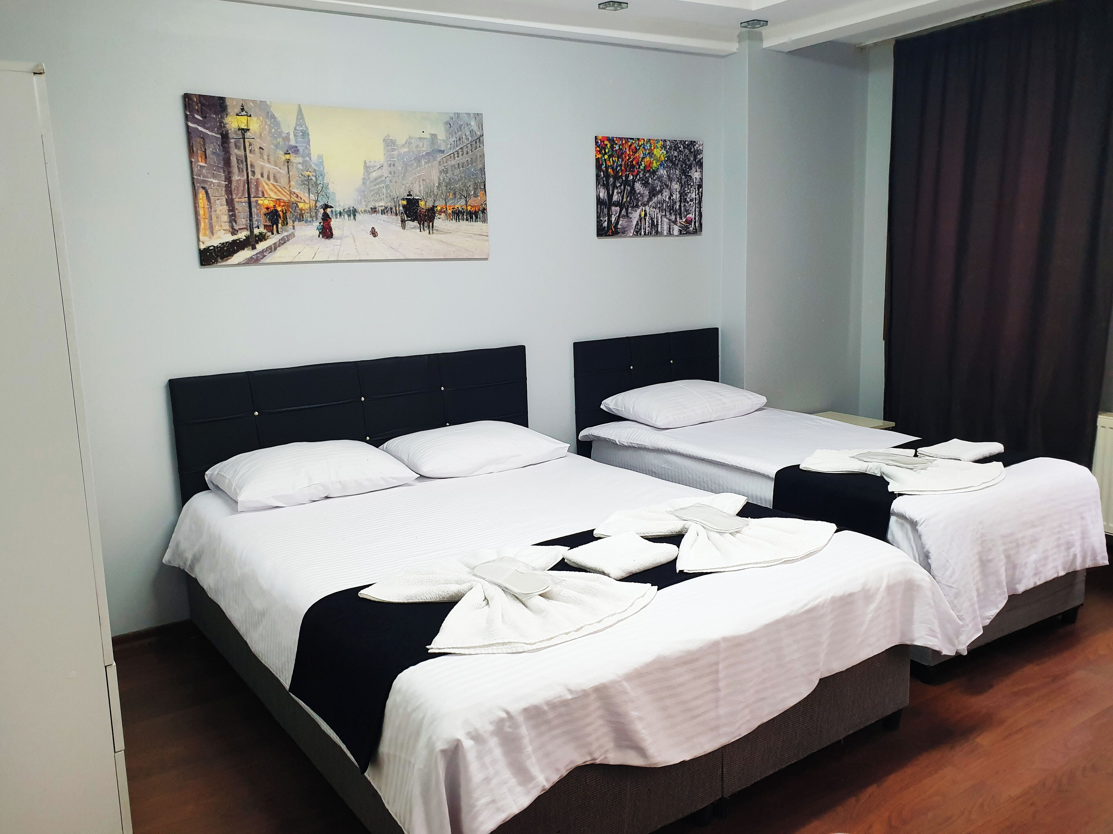 Desk, laptop workspace, blackout drapes, iron/ironing board