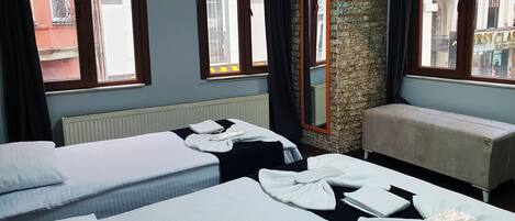 Desk, laptop workspace, blackout drapes, iron/ironing board