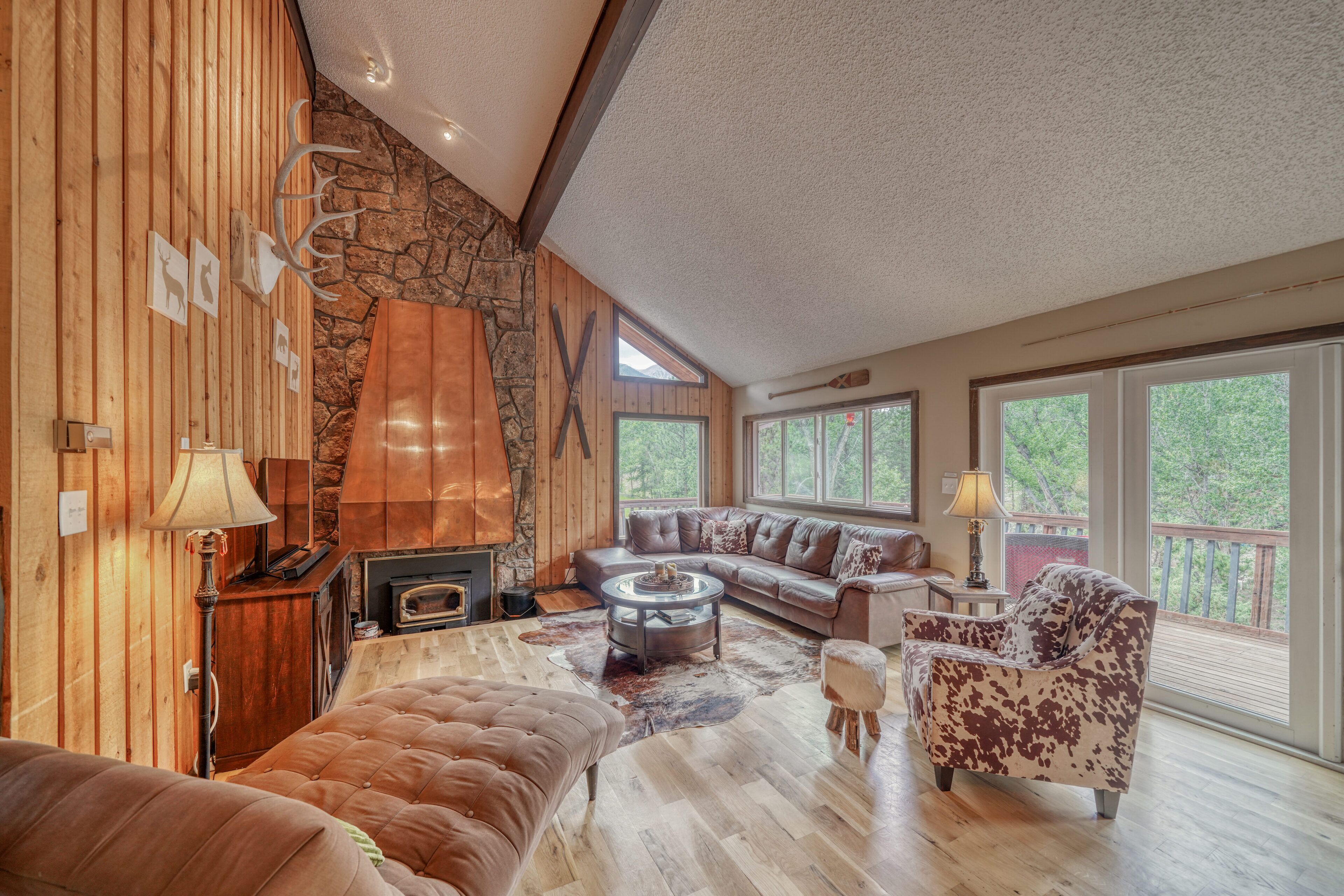 Large open-concept living room with fireplace and TV with streaming capabilities.