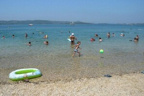 On the beach, sun-loungers