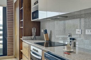 Coffee/tea maker, fridge, microwave, oven