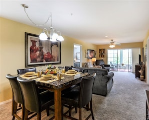 Enjoy meals in style with a beautifully set dining table and comfortable seating for six.