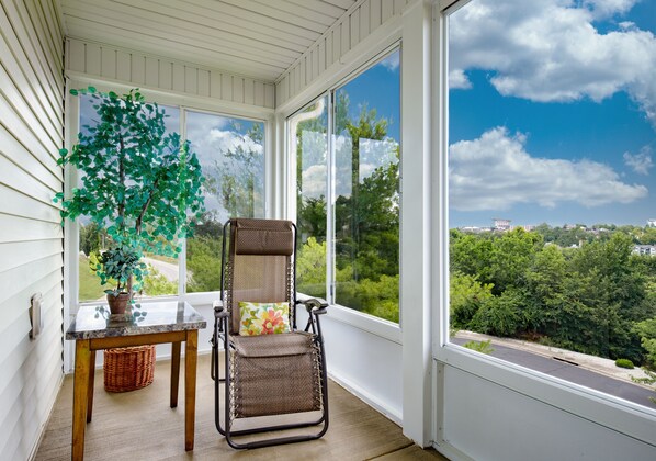 Relax on the porch with a panoramic view of the surrounding landscape.