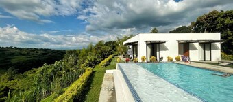 Gated Retreat with Infinity Pool & Epic Views.  Close to Parque del Cafe.