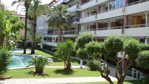 A multi-story hotel with balconies, a swimming pool, and well-maintained gardens. - Anacasa Dianium Ausias March AP1112 (Denia)