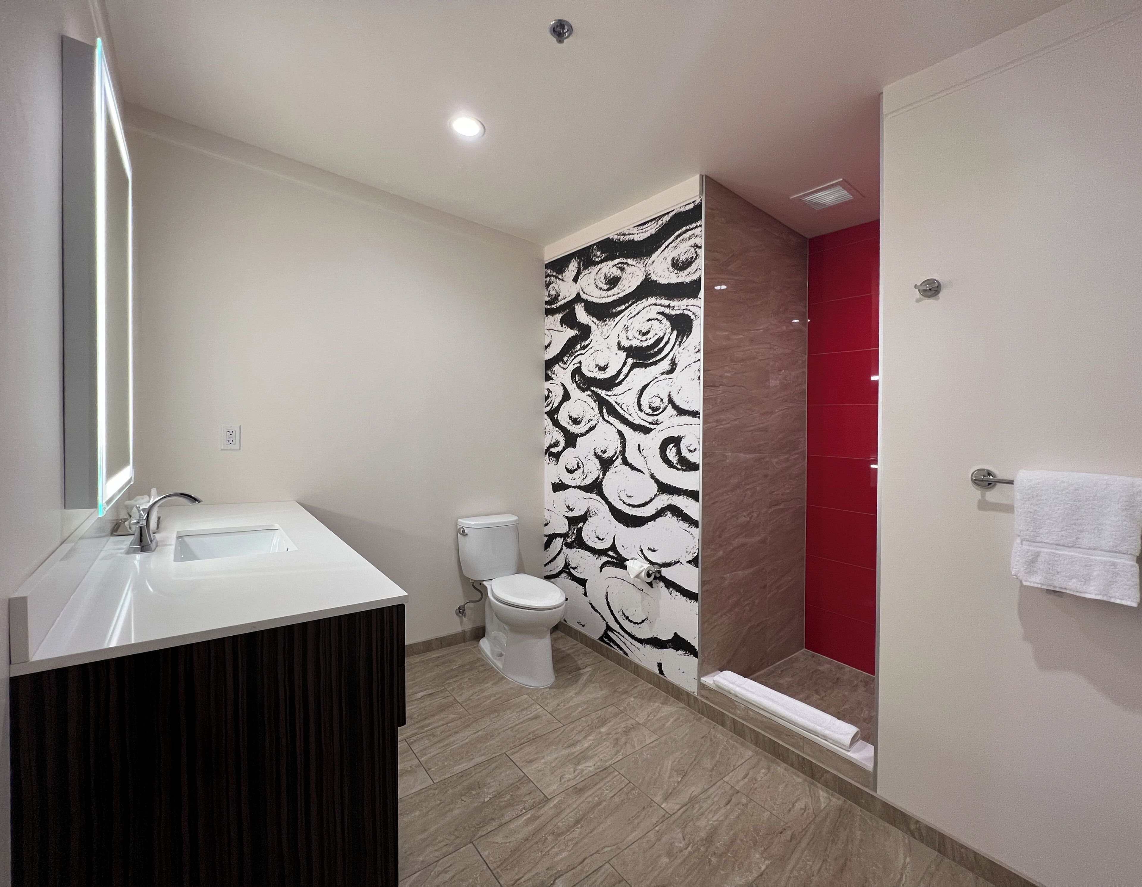 signature suite | bathroom | shower, free toiletries, hair dryer, towels