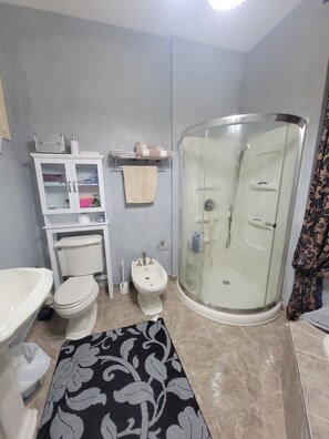 Bathtub, hair dryer, towels, soap