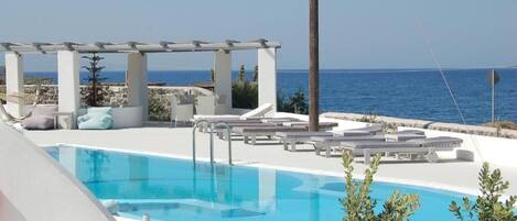 Outdoor pool, open 8:00 AM to 8:00 PM, pool umbrellas, sun loungers