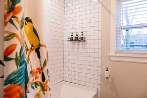 Combined shower/tub, hair dryer, towels, soap