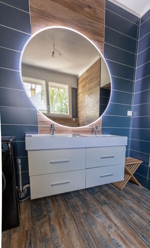 Bathtub, hair dryer, towels, soap