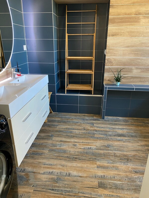 Bathtub, hair dryer, towels, soap