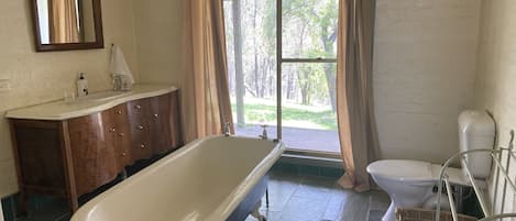 Bathtub, hair dryer, towels, soap