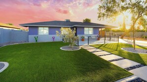 A modern two-story house with a well-maintained lawn, a patio area, and a clear sky. - Awesome Downtown Gilbert location | Pets welcome (Gilbert)