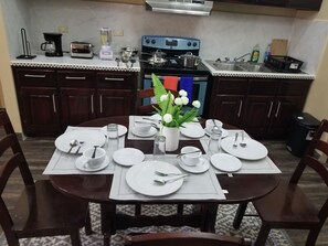 Fridge, stovetop, blender, cookware/dishes/utensils - Royal View Apartment - Two bedroom, two bathrooms (Belize City)
