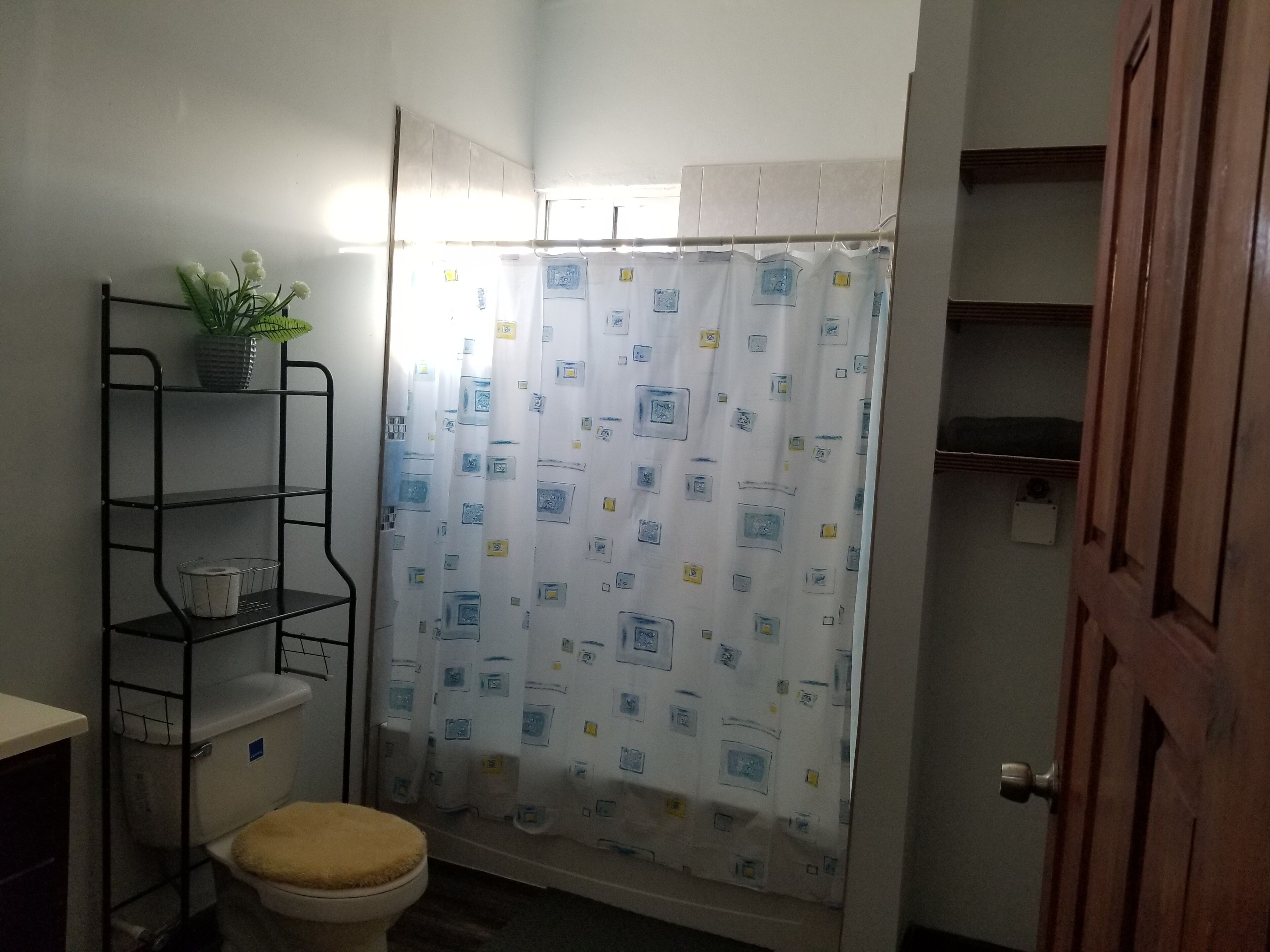 Bathtub, towels, soap, toilet paper