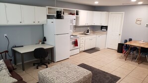 A compact living space with a kitchenette, a dining area, and a seating area. - Centrally Located Mesa Studio (Mesa)