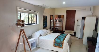 Studio style self contained room, steps to the beach.