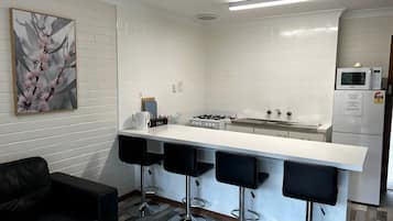 Coffee/tea maker, fridge, microwave, oven