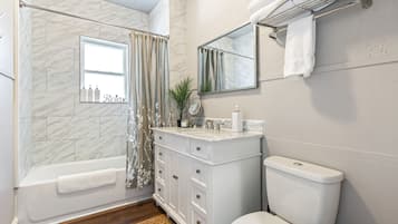 Combined shower/tub, hair dryer, towels, soap