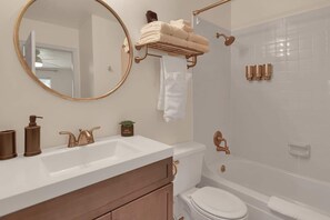 Combined shower/bathtub, hair dryer, towels, soap