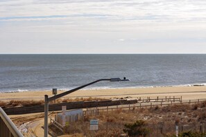 Enjoy the serene beachside setting with a sandy beach and ocean views.