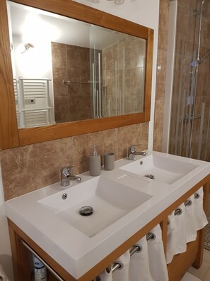 Shower, hair dryer, towels, soap