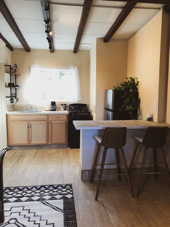 Fridge, stovetop, coffee/tea maker, cookware/dishes/utensils