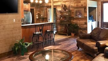 Smart TV, fireplace, books, stereo