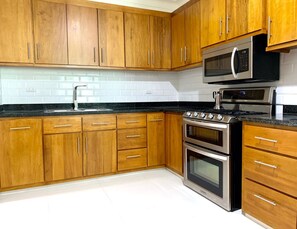Microwave, coffee/tea maker, cookware/dishes/utensils