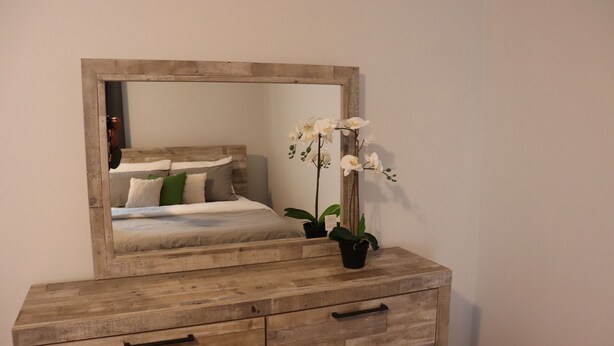 A wooden dresser with drawers and a mirror above it. - Detached 3 BR home in Ajax,ON (Ajax)