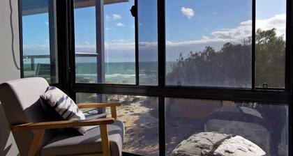 Beachfront ocean-view apartment with balcony