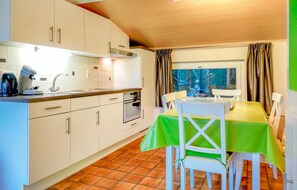 Fridge, stovetop, dishwasher, coffee/tea maker