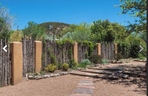 Stroll through the garden, surrounded by lush greenery and a tranquil atmosphere.