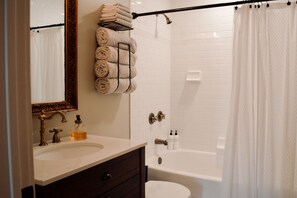 Combined shower/bathtub, hair dryer, towels, soap