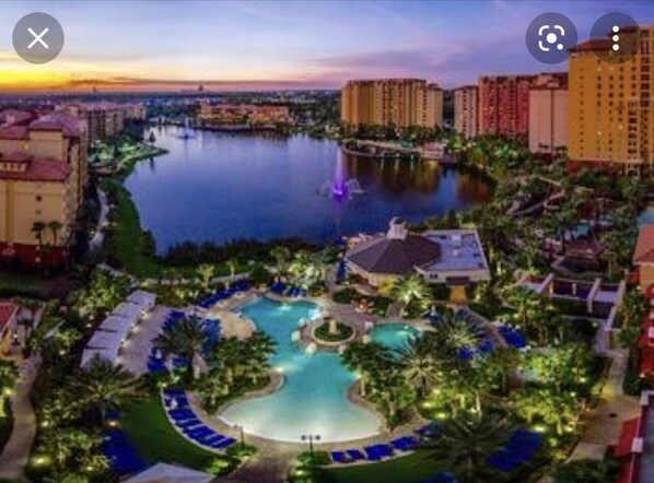 Relax by the resort's central pool surrounded by lounge areas and enjoy the serene views of the adjacent water.
