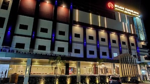 A multi-story hotel with a prominent sign reading "RYLICH PAMORAMA HOTEL". - Rylich Panorama Hotel (Sorong)