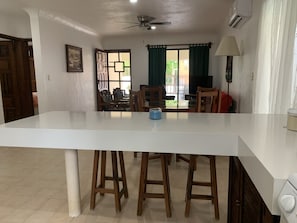 Enjoy meals in this dining area with a large table and comfortable seating.