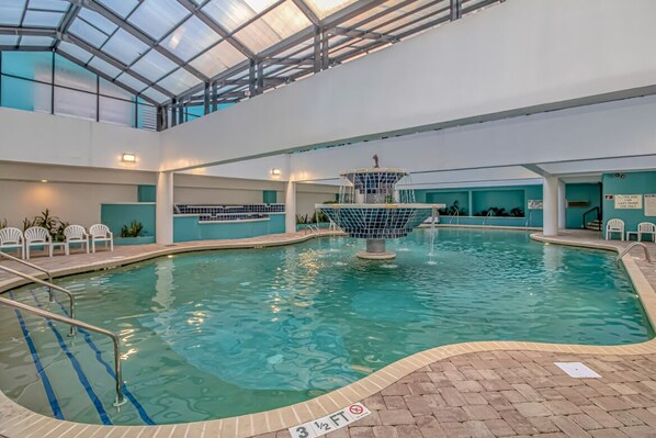 Relax by the pool surrounded by a spacious deck and a soothing fountain.