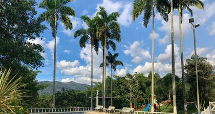 Room with 1 double bed and 2 single beds