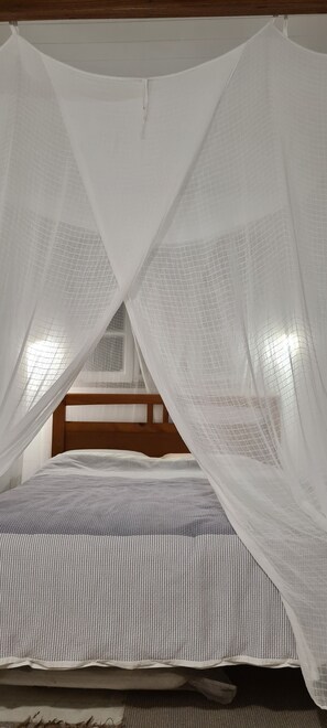 Rest in comfort under a cozy canopy.