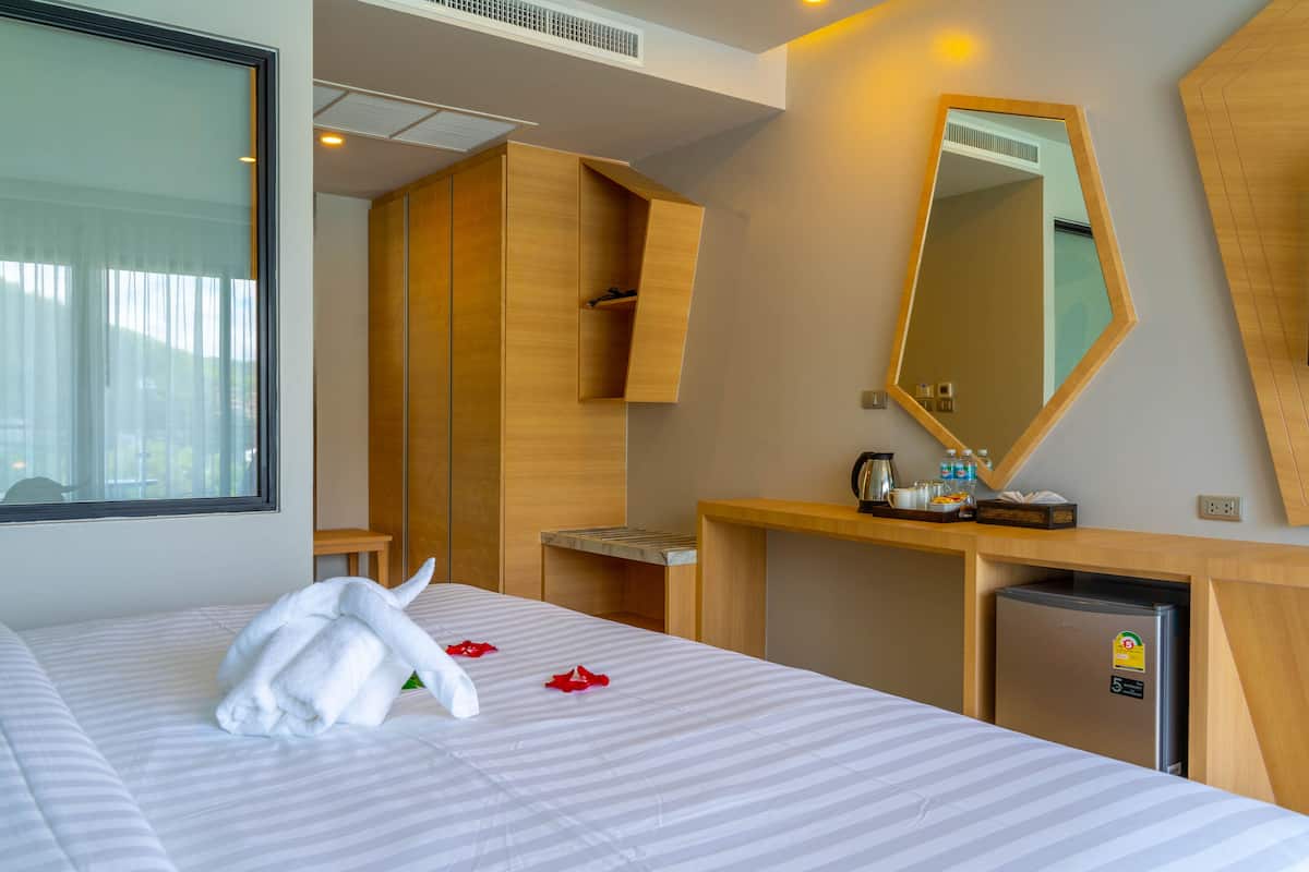 Deluxe Double or Twin Room | Minibar, in-room safe, individually decorated, desk