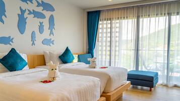 Habitación Deluxe con 1 cama matrimonial o 2 individuales | Minibar, caja de seguridad en la habitación y decoración personalizada