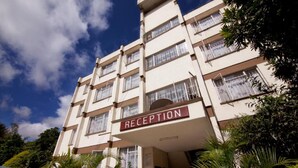 A multi-story building with a reception area marked on the facade. - GraceHouse Resort (Nairobi)