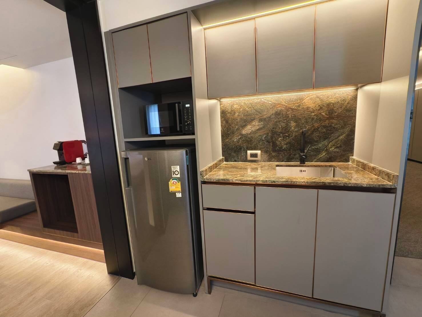 deluxe pool view corner | in-room safe, desk, laptop workspace, blackout curtains